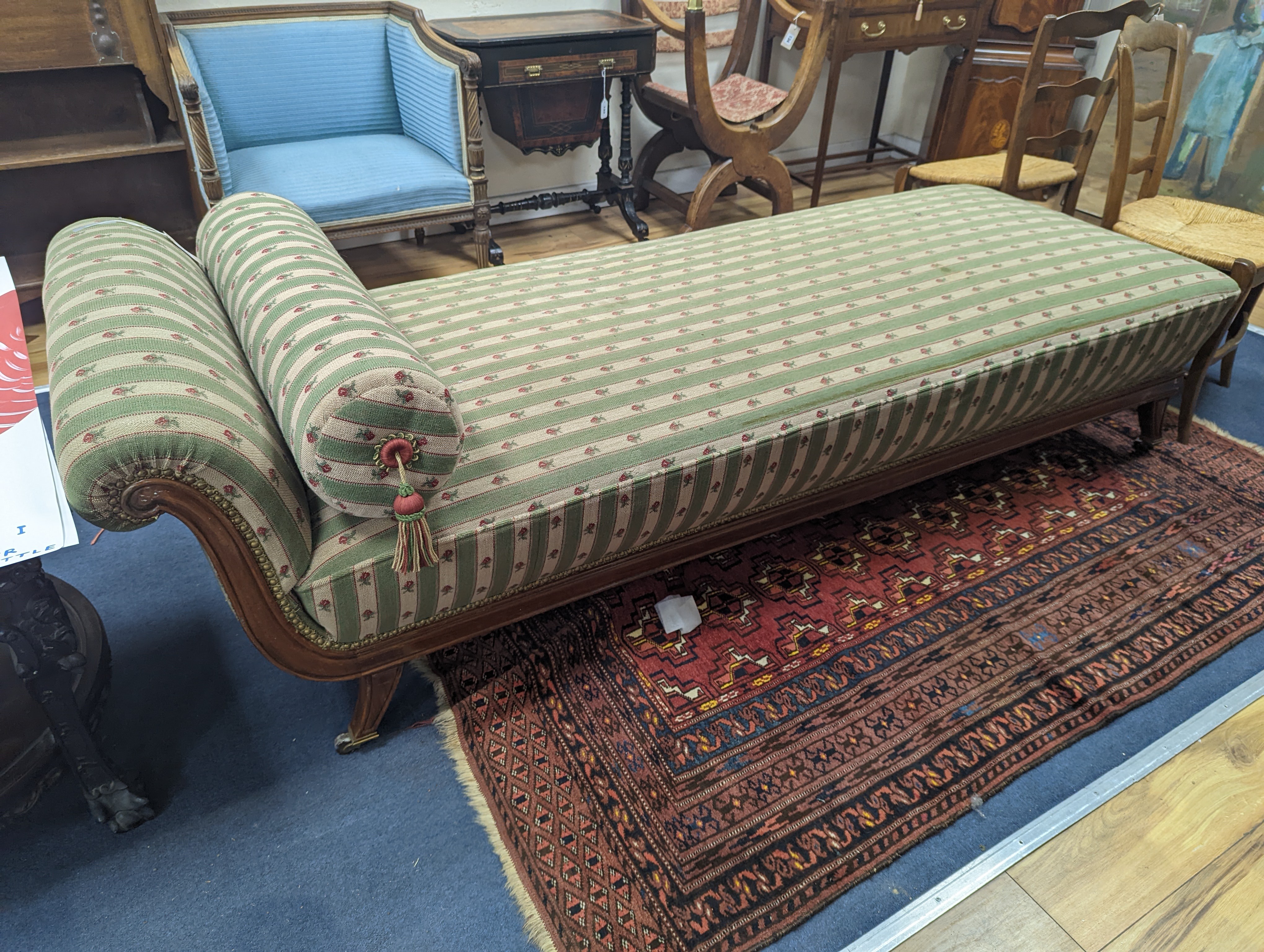 A 19th century Continental mahogany upholstered day bed, length 210cm, width 78cm, height 64cm